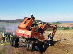 Brennt Baumaschine